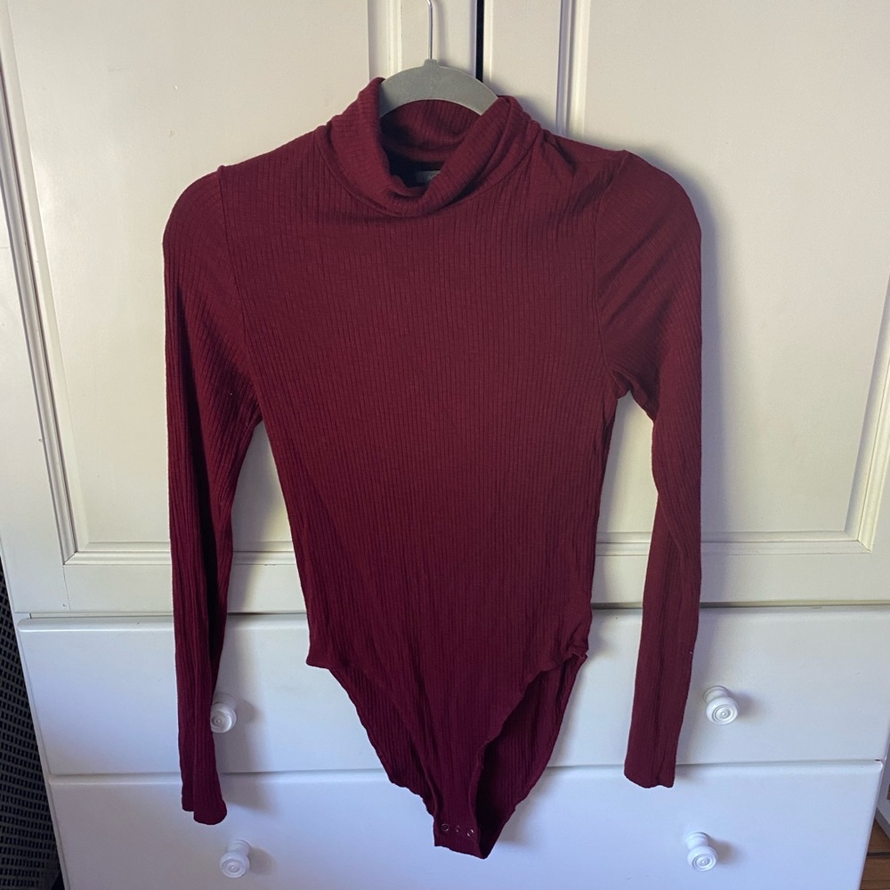 Long sleeve turtle neck body suit.